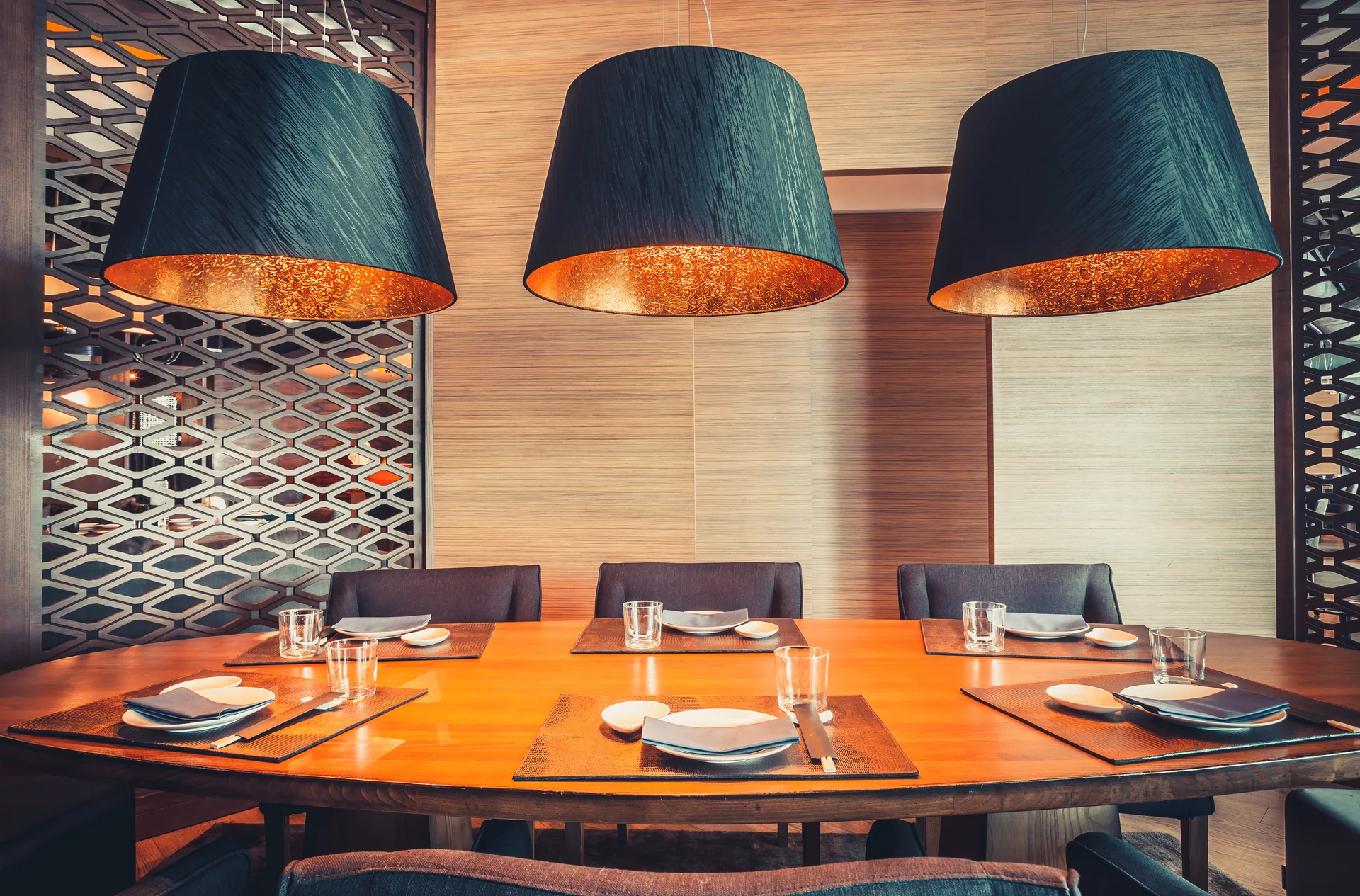 Restaurant table with plates, cutlery, and napkins ready for service